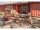 A wooden deck with built-in bench seating, flower planters, and a charming entrance to the home at 6312 New Market Way, Raleigh, NC 27615