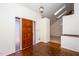 Inviting entryway with a wooden front door, parquet floors, and skylights at 6312 New Market Way, Raleigh, NC 27615