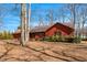 Single-Gathering home featuring an attached garage, mature trees and manicured landscaping at 6312 New Market Way, Raleigh, NC 27615