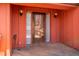 A covered wooden porch leading to the front door with classic outdoor lighting at 6312 New Market Way, Raleigh, NC 27615