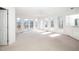 Living room boasts neutral walls, sliding glass doors, and outdoor deck access at 6312 New Market Way, Raleigh, NC 27615