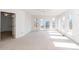 Living room with neutral walls, sliding glass doors, and outdoor deck access at 6312 New Market Way, Raleigh, NC 27615