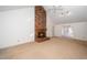 Spacious living room with a brick fireplace, ceiling fan, and natural light at 6312 New Market Way, Raleigh, NC 27615