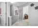 Upstairs hallway with neutral decor and access to multiple rooms and lots of light at 642 Thistle Dr, Burlington, NC 27217