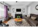 Bright living room featuring modern decor, comfortable seating, stylish rug, and natural light at 642 Thistle Dr, Burlington, NC 27217