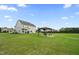 Spacious backyard featuring a gazebo with seating, providing an inviting outdoor living space at 6804 Arlington Oaks Trl, Raleigh, NC 27603
