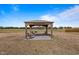 Backyard gazebo featuring chairs and a tranquil setting, great for outdoor relaxation and enjoying the view at 6804 Arlington Oaks Trl, Raleigh, NC 27603