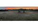 Backyard featuring a gazebo surrounded by a wide open grassy area and tree line at 6804 Arlington Oaks Trl, Raleigh, NC 27603