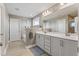 Large primary bathroom has double vanity and soaking tub at 6804 Arlington Oaks Trl, Raleigh, NC 27603