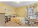 Charming bedroom with yellow walls, white furniture, and a cheerful, inviting atmosphere at 6804 Arlington Oaks Trl, Raleigh, NC 27603
