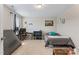 Spacious bedroom with a bed, desk, and ample space for relaxing and studying at 6804 Arlington Oaks Trl, Raleigh, NC 27603