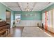 Bright bonus room with hardwood floors, yoga mats, and natural light from multiple windows at 6804 Arlington Oaks Trl, Raleigh, NC 27603