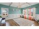Bright bonus room with hardwood floors, yoga mats, and natural light from multiple windows at 6804 Arlington Oaks Trl, Raleigh, NC 27603