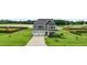 Beautiful home with a well-manicured lawn and a spacious driveway leading to a two-car garage at 6804 Arlington Oaks Trl, Raleigh, NC 27603