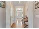 Inviting foyer with hardwood floors and neutral paint at 6804 Arlington Oaks Trl, Raleigh, NC 27603