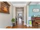Hardwood floors lead from the foyer to a bright bonus room and the living room at 6804 Arlington Oaks Trl, Raleigh, NC 27603
