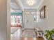 Inviting foyer with hardwood floors, neutral paint, and a view into the bonus room at 6804 Arlington Oaks Trl, Raleigh, NC 27603