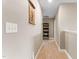 Inviting hallway with neutral walls and carpet, showcasing the home's layout at 6804 Arlington Oaks Trl, Raleigh, NC 27603