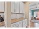 Granite countertops and white subway tile backsplash add elegance to this bright and modern kitchen at 6804 Arlington Oaks Trl, Raleigh, NC 27603