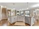 Open kitchen with a view to the living room featuring granite counters and stainless appliances at 6804 Arlington Oaks Trl, Raleigh, NC 27603