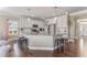 Open kitchen with granite counters, stainless steel appliances, and island with seating at 6804 Arlington Oaks Trl, Raleigh, NC 27603