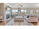 Spacious living room with fireplace, large windows, stylish decor, and comfortable seating at 6804 Arlington Oaks Trl, Raleigh, NC 27603