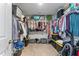 Large walk-in closet with rods, shelving, and ample storage space for organization at 6804 Arlington Oaks Trl, Raleigh, NC 27603