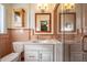 Bathroom with a pink tiled wall, sink, mirror, and a walk-in shower at 708 Kenmore Rd, Chapel Hill, NC 27514