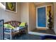 Charming entryway with a cozy bench, vibrant blue door, and stylish slate flooring at 708 Kenmore Rd, Chapel Hill, NC 27514