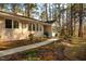 Inviting one-story home with a charming landscaped front yard and pathway to the front door at 708 Kenmore Rd, Chapel Hill, NC 27514