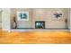 Close up of the living room fireplace with hardwood floors at 708 Kenmore Rd, Chapel Hill, NC 27514