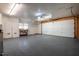 Spacious garage featuring epoxy flooring, shelving, and an insulated garage door for added convenience and comfort at 708 Kenmore Rd, Chapel Hill, NC 27514