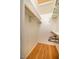 Walk-in closet with hardwood floors, skylight, and white walls and shelves with racks for storage at 708 Kenmore Rd, Chapel Hill, NC 27514