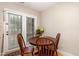 Cozy breakfast nook with a view of the outdoors and a charming round table at 7925 Brown Bark Pl, Raleigh, NC 27615