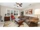 Cozy living room featuring a large window, comfortable seating, and elegant decor at 7925 Brown Bark Pl, Raleigh, NC 27615