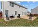 Backyard with a concrete patio featuring an outdoor seating area, a grill and a well-maintained lawn at 80 Ingle View Ct, Burlington, NC 27215