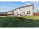Spacious backyard featuring a hammock and patio area, perfect for outdoor relaxation and entertaining in style at 80 Ingle View Ct, Burlington, NC 27215