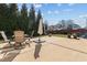 The spacious backyard features a concrete patio with outdoor furniture for entertaining, and a well-maintained lawn at 80 Ingle View Ct, Burlington, NC 27215