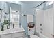 Bright bathroom with a shower and tub, a vanity with modern fixtures, and toilet at 80 Ingle View Ct, Burlington, NC 27215