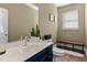 The stylish bathroom featuring a large mirror, modern vanity, and coordinated fixtures creating an inviting area at 80 Ingle View Ct, Burlington, NC 27215