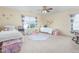 bedroom featuring twin beds, colorful decor, and ample natural light at 80 Ingle View Ct, Burlington, NC 27215