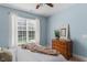 Comfortable bedroom with dresser and a large window with natural light at 80 Ingle View Ct, Burlington, NC 27215
