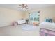 Bright bedroom with neutral walls and two white metal frame beds at 80 Ingle View Ct, Burlington, NC 27215