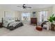 Comfortable bedroom with light yellow walls, large windows, and hardwood floors at 80 Ingle View Ct, Burlington, NC 27215