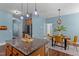Open dining space with stylish light fixture and table with seating for four at 80 Ingle View Ct, Burlington, NC 27215