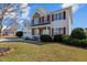 Charming two-story home boasts a well-manicured lawn and a convenient two-car garage at 80 Ingle View Ct, Burlington, NC 27215