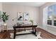 Bright home office with hardwood floors, natural light, and stylish decor for productivity at 80 Ingle View Ct, Burlington, NC 27215