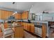 Well-lit kitchen featuring granite countertops, stainless steel appliances, and an open design to the living space at 80 Ingle View Ct, Burlington, NC 27215
