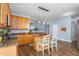 Bright kitchen featuring wood cabinets, granite countertops, and stainless steel appliances at 80 Ingle View Ct, Burlington, NC 27215