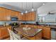 Contemporary kitchen featuring stainless appliances and center island with barstool seating at 80 Ingle View Ct, Burlington, NC 27215